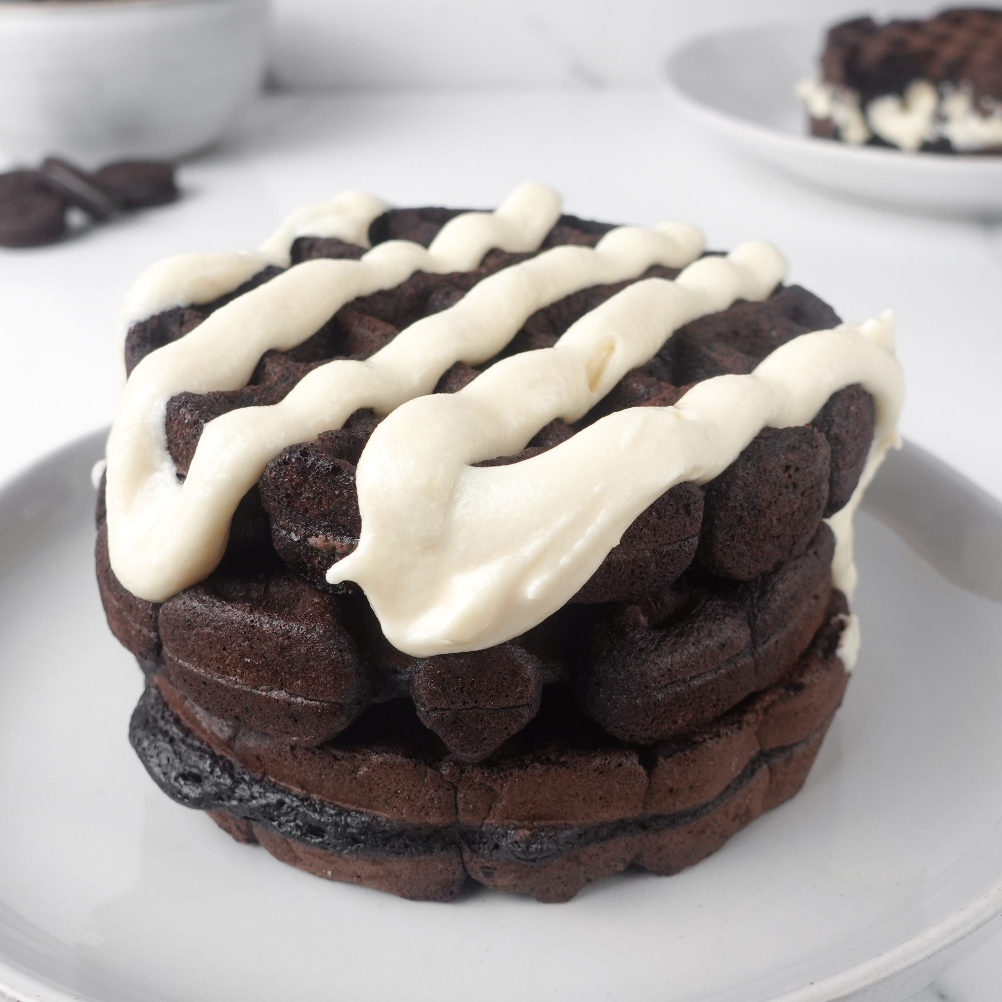 Oreo cream drizzled over waffles