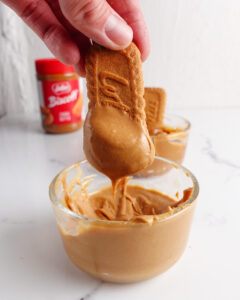 Dipping biscoff cookie in cookie butter